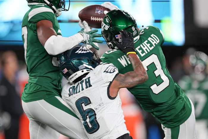 Oct 15, 2023; East Rutherford, New Jersey, USA; New York Jets safety Jordan Whitehead (3) breaks up a pass intended for Philadelphia Eagles wide receiver DeVonta Smith (6) in front of cornerback Bryce Hall (37) during the second half at MetLife Stadium.